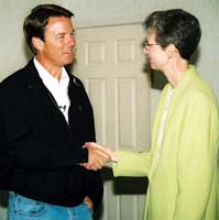 Council 222 President Carolyn Federoff shakes hands with presidential candidate John Edwards